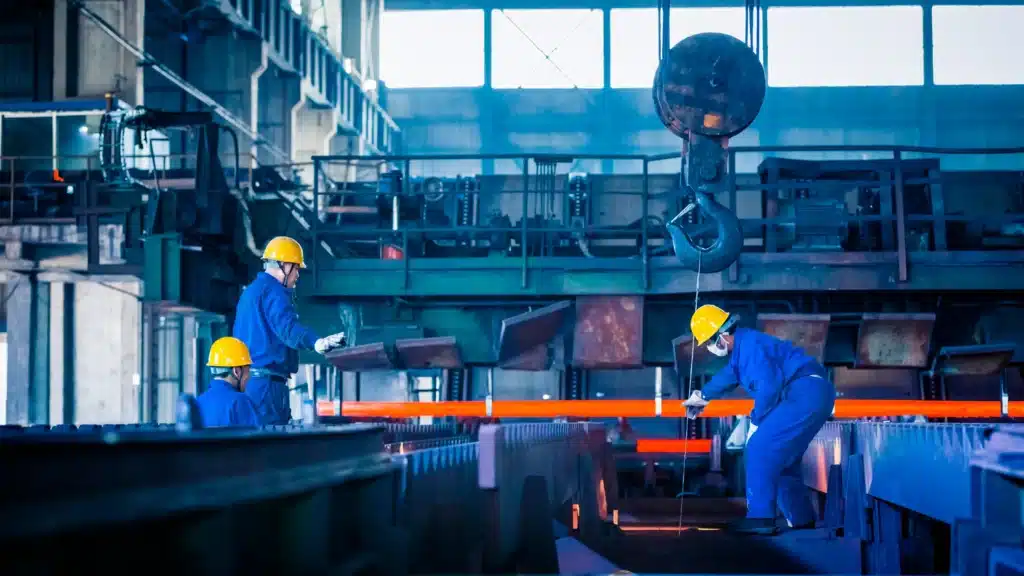Modern U.S. steel plant with automated robotics and engineers showcasing green steel innovation in 2025.
