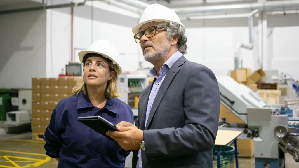 Steel plant manager leading production operations in a manufacturing facility