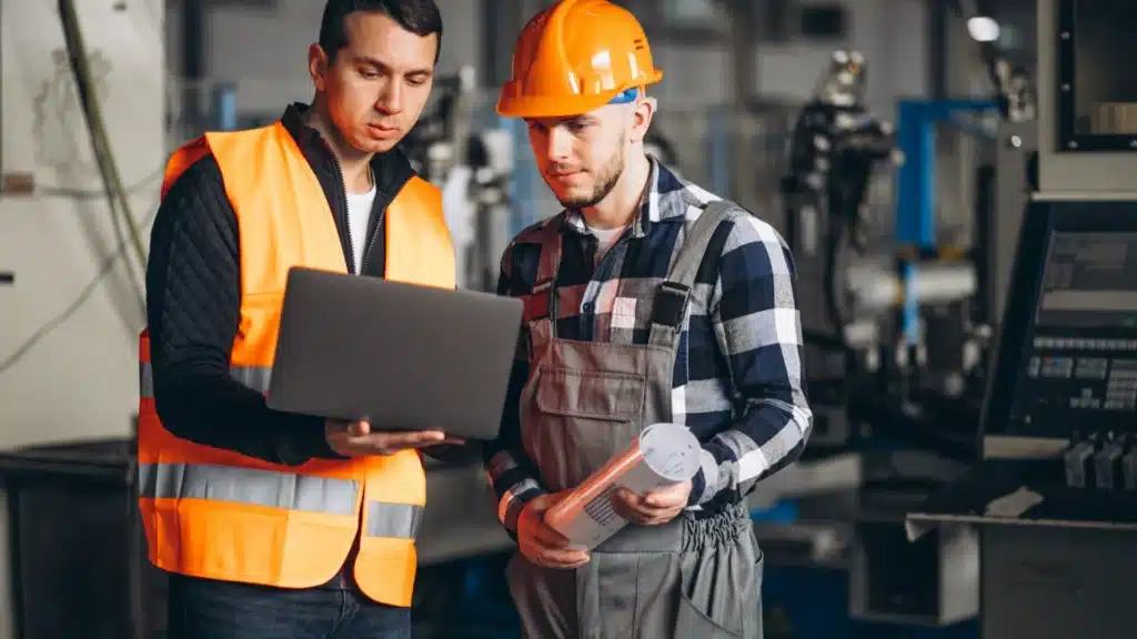 Manufacturing plant manager supervising production operations in a metal manufacturing facility